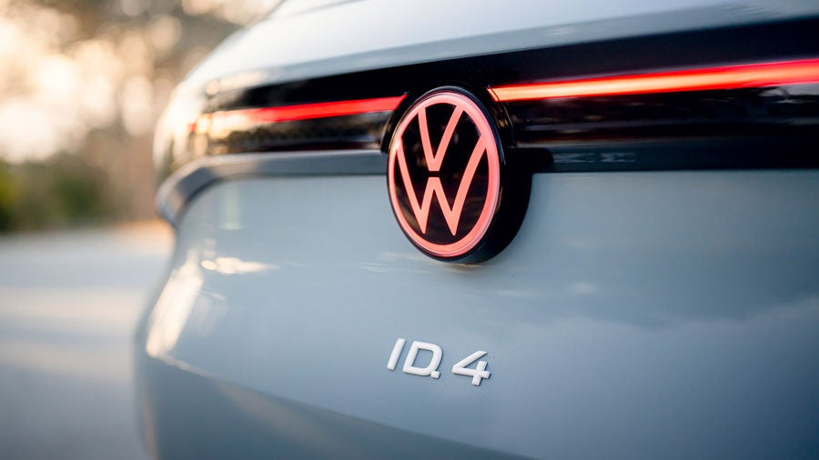 A close-up shot of the available Illuminated rear VW badge on an ID.4 in Pure Gray.
